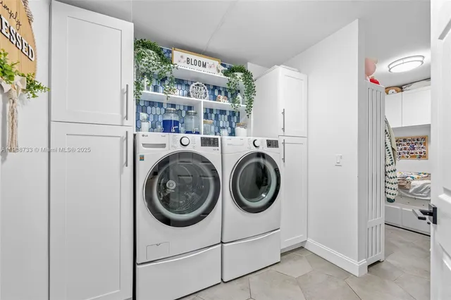 a utility room with dryer and washer