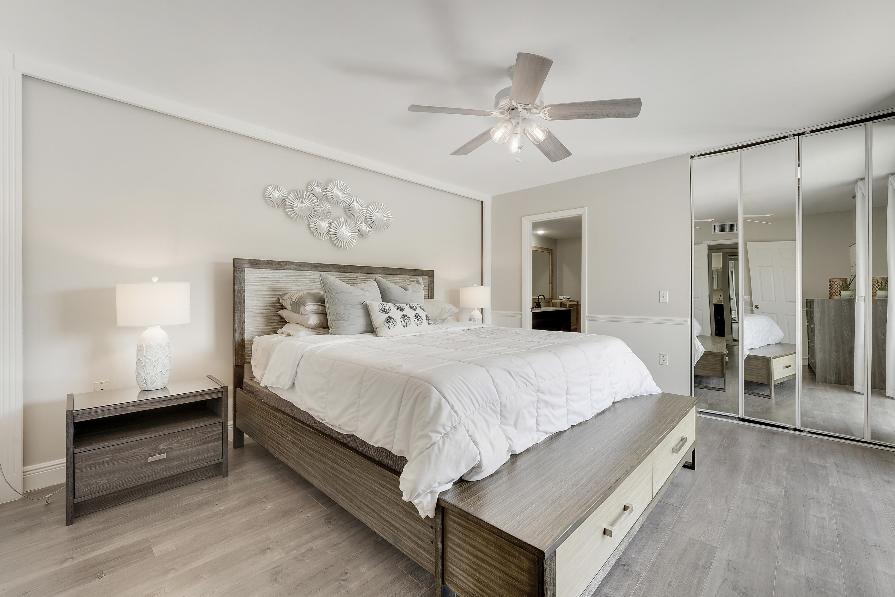 3900 County Line Road, Unit 4C Tequesta, FL 33469 - Photo 13 of 41 a bed room with a bed and a chandelier