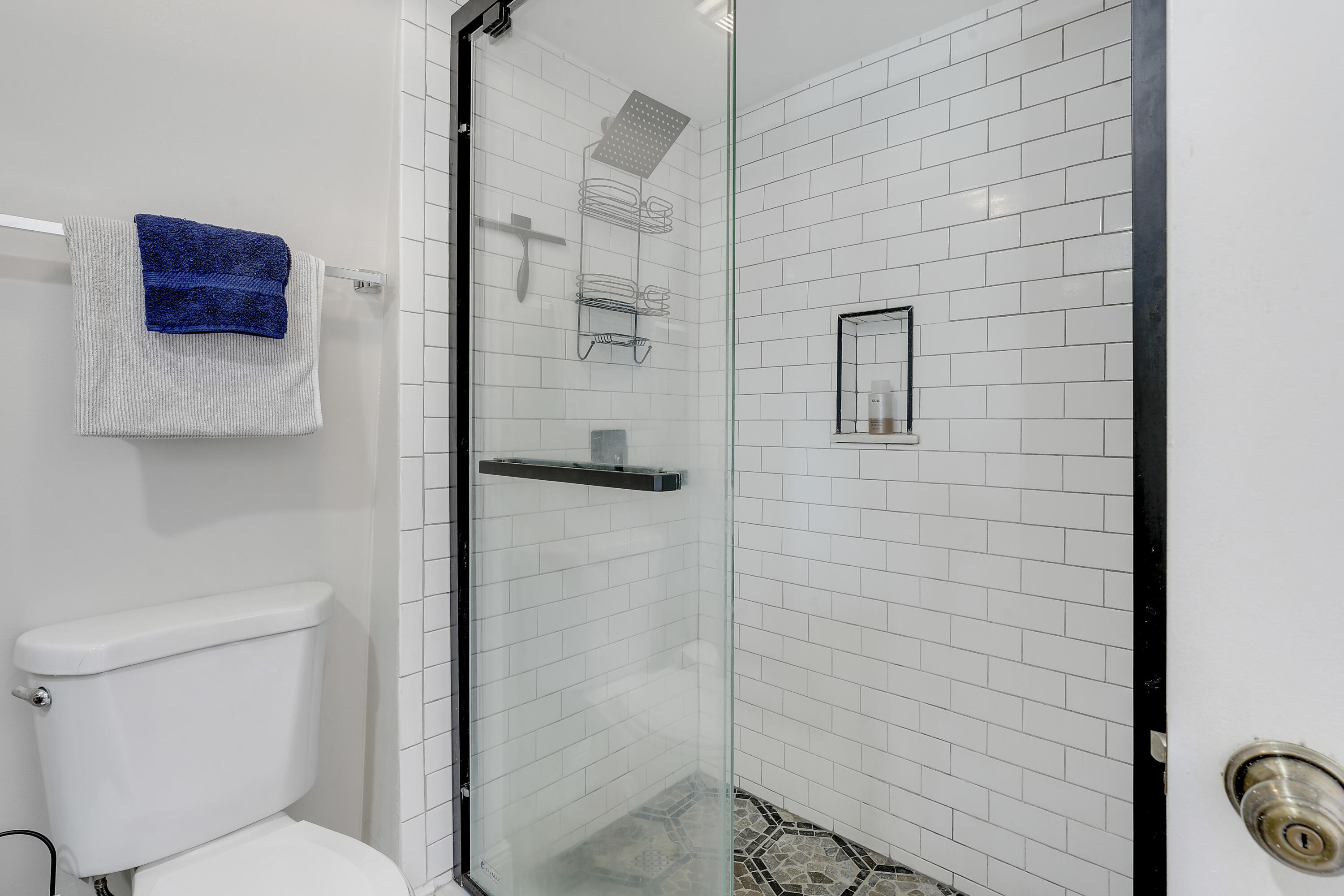 3900 County Line Road, Unit 4C Tequesta, FL 33469 - Photo 16 of 41 a bathroom with a toilet and a shower