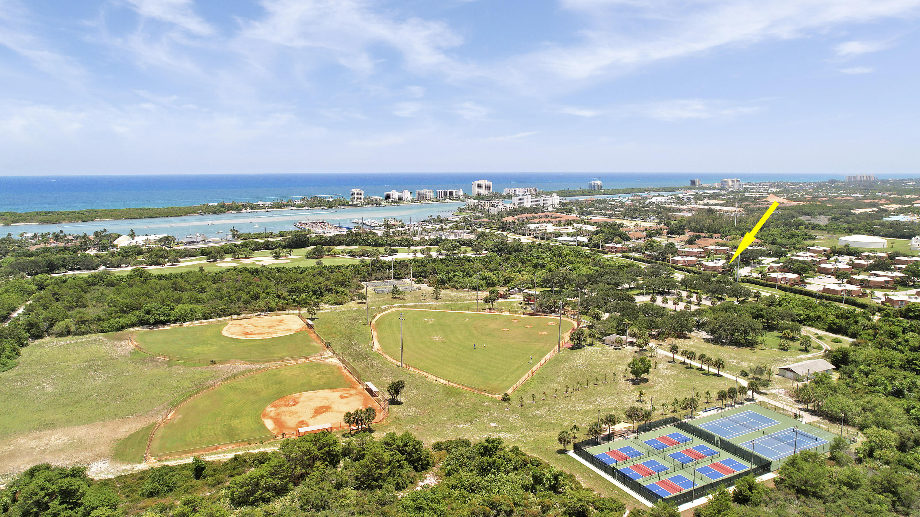 3900 County Line Road, Unit 4C Tequesta, FL 33469 - Photo 26 of 41 an aerial view of residential houses with outdoor space
