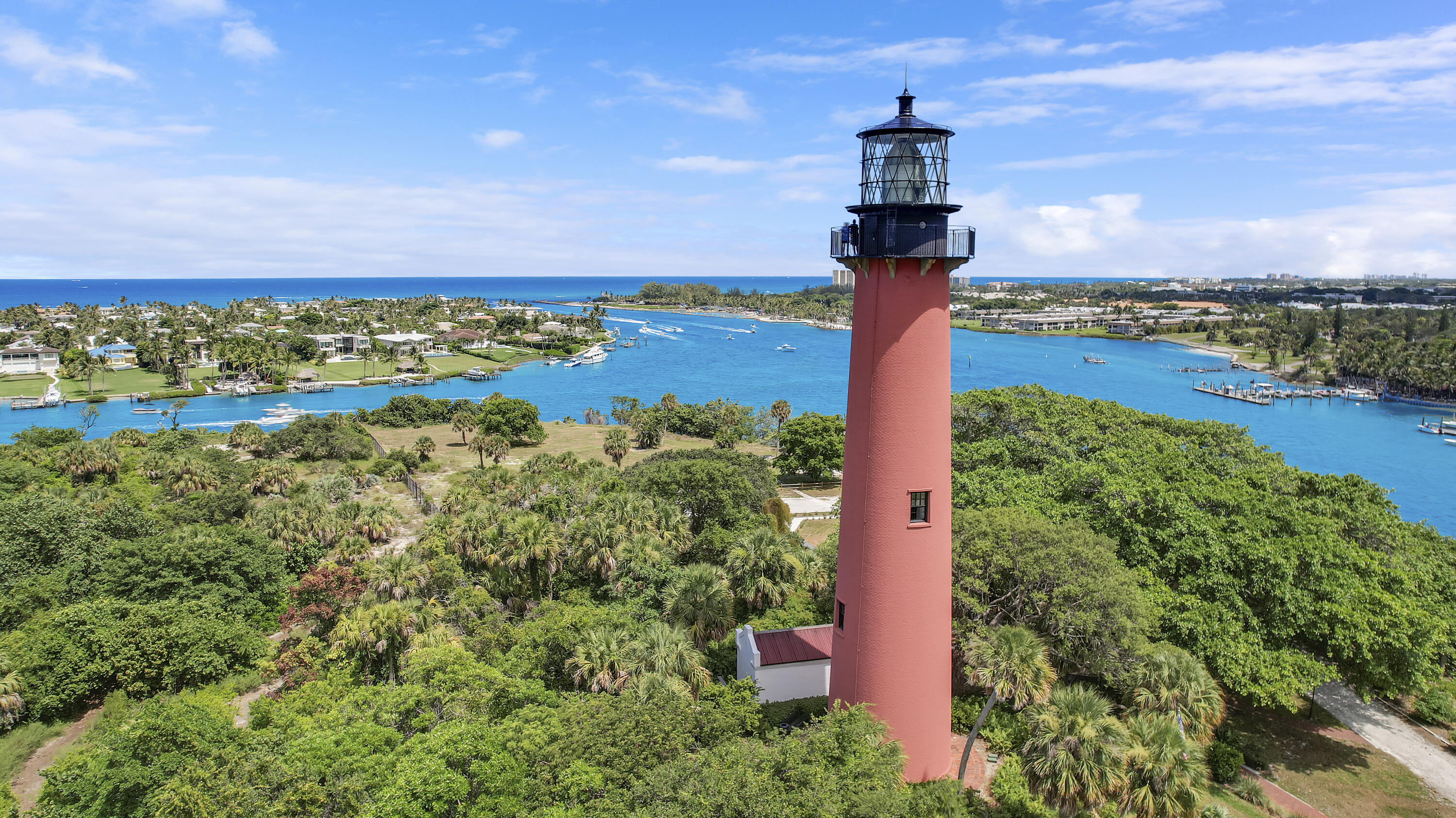 3900 County Line Road, Unit 4C Tequesta, FL 33469 - Photo 27 of 41 a view of a city with a building in the background