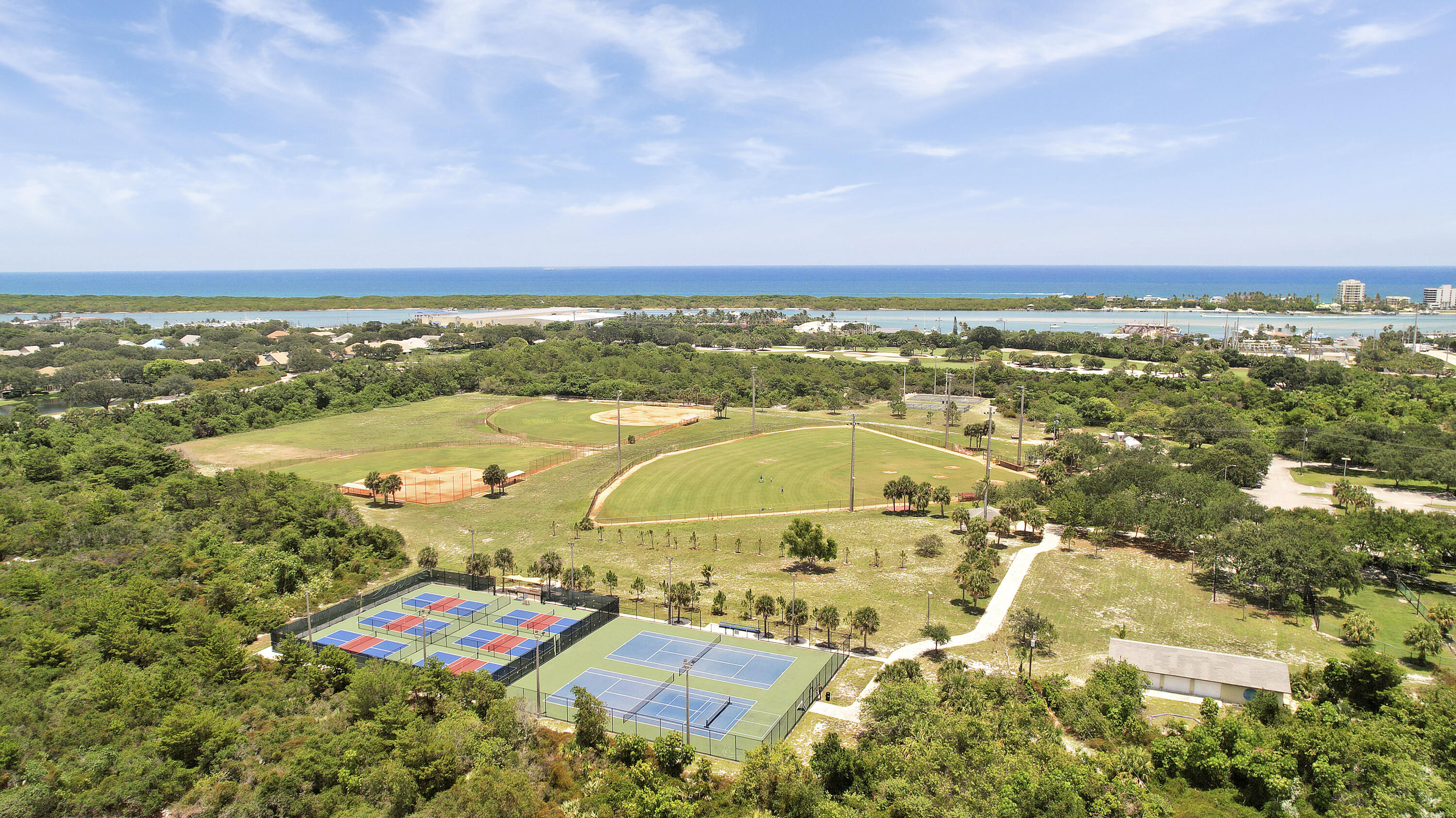 3900 County Line Road, Unit 4C Tequesta, FL 33469 - Photo 39 of 41 an aerial view of residential houses with outdoor space