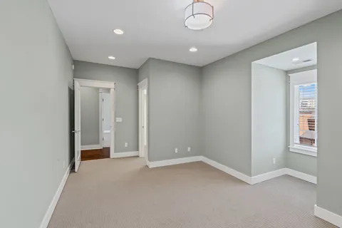 a spacious bathroom with a granite countertop sink mirror and