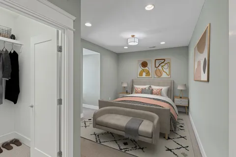 an empty room with a chandelier fan and windows