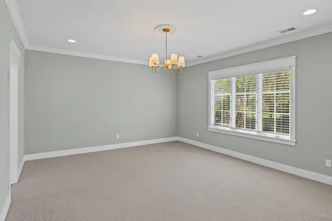 a living room with furniture and a lamp