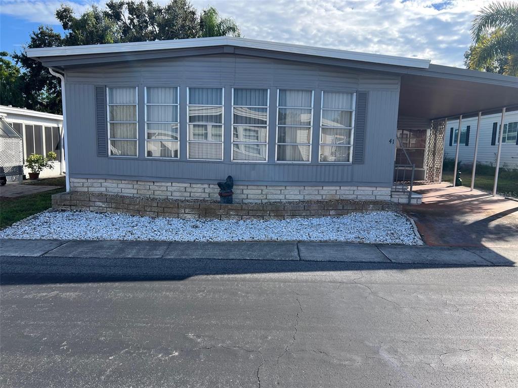 41 Royal Palm Circle Largo, FL 33778 - Photo 2 of 27 a front view of a house