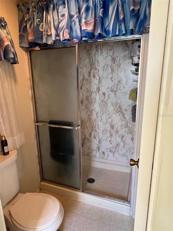 41 Royal Palm Circle Largo, FL 33778 - Photo 26 of 27 a bathroom with a toilet and a shower