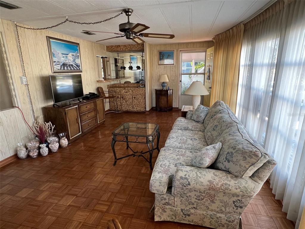 41 Royal Palm Circle Largo, FL 33778 - Photo 7 of 27 a living room with furniture and a flat screen tv