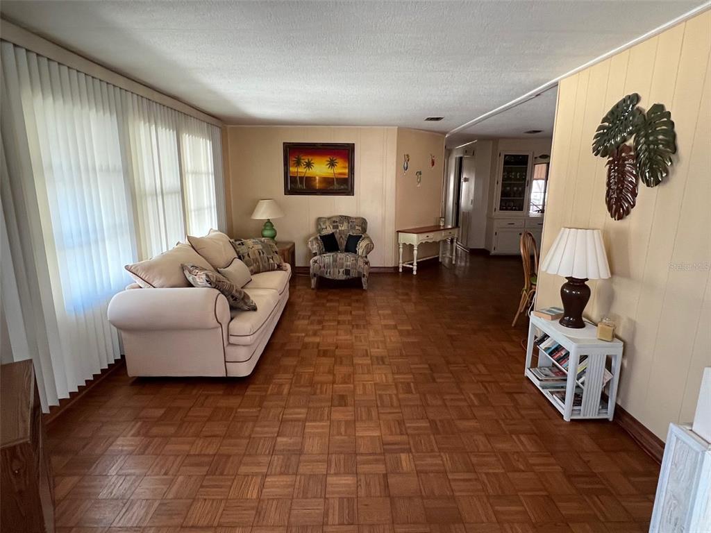 41 Royal Palm Circle Largo, FL 33778 - Photo 9 of 27 a living room with furniture and a window
