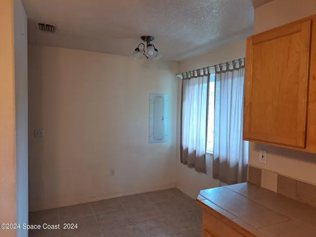 a view of a hallway with a window