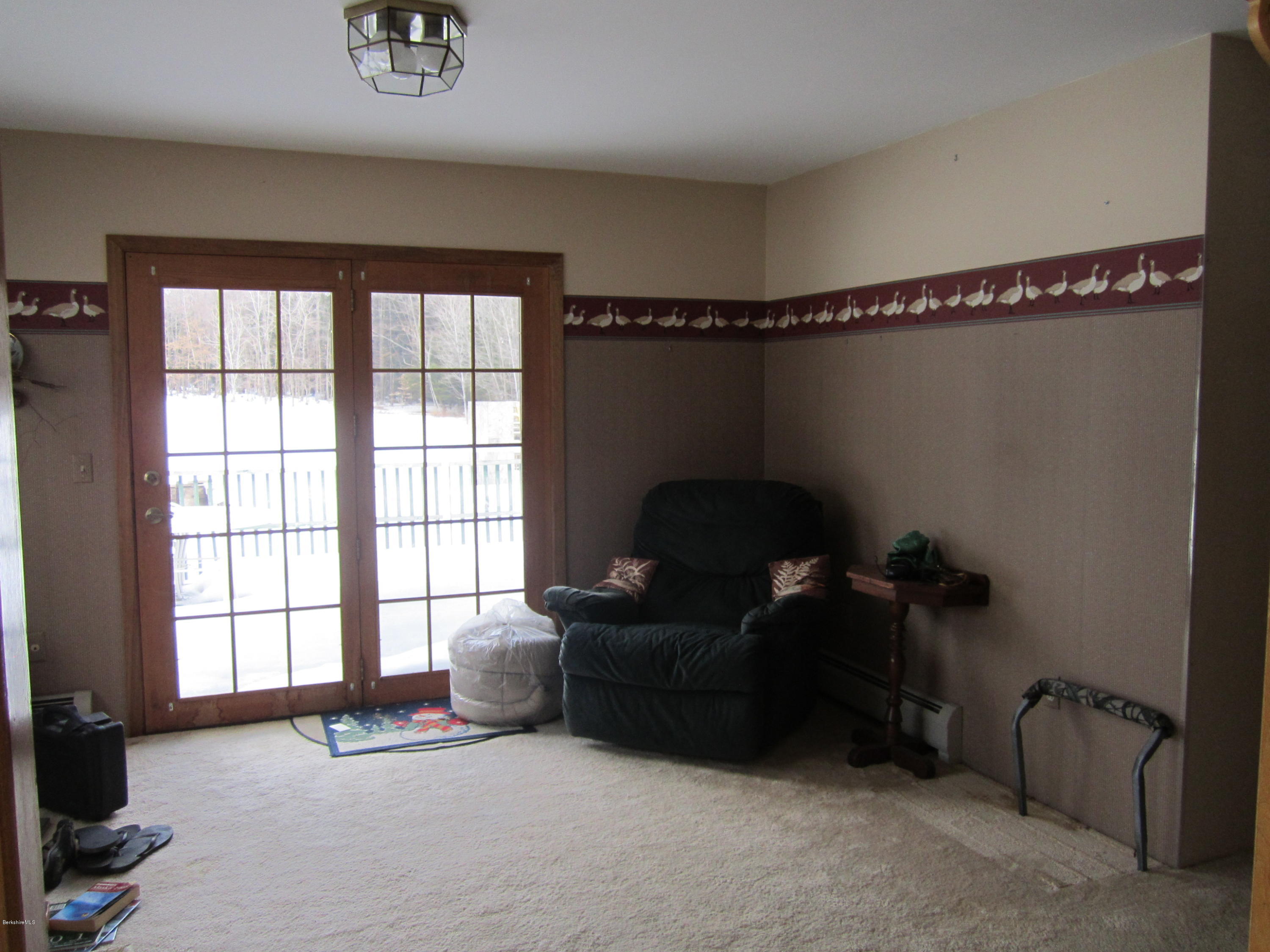 711 Middle Road Clarksburg, MA 01247 - Photo 3 of 10 a living room with furniture and a window