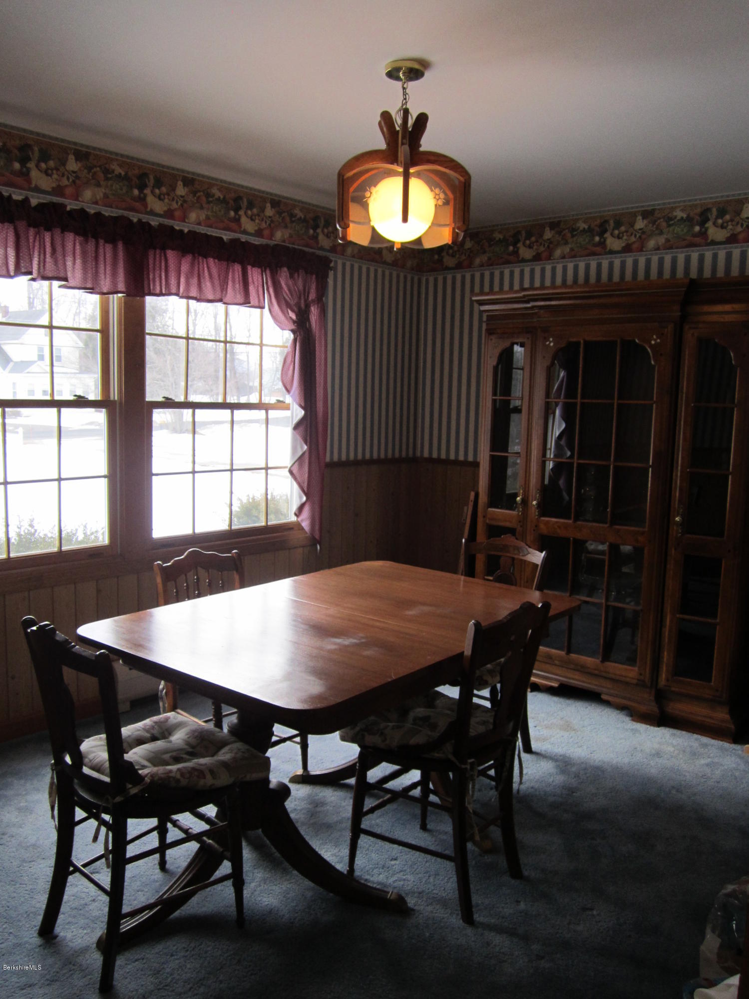 711 Middle Road Clarksburg, MA 01247 - Photo 4 of 10 a view of a dining room with furniture and chandelier