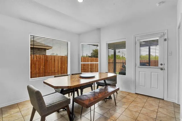 a view of a dining room with furniture and window