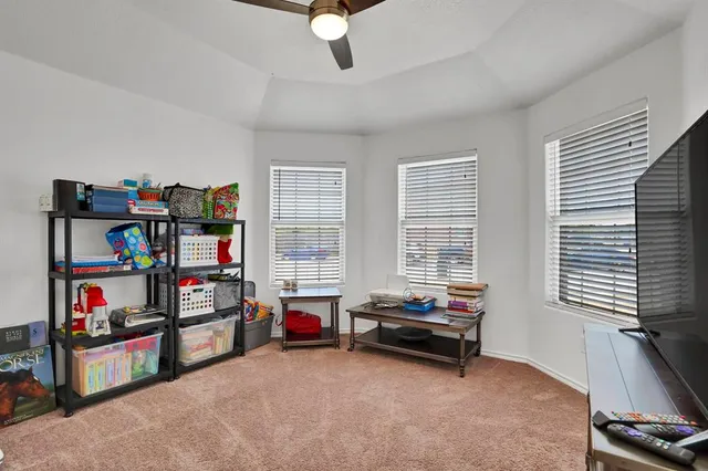 a room with furniture and a book shelf