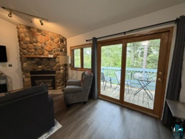 6266 Giants Ridge Road Biwabik, MN 55705 - Photo 3 of 30 Stone-clad fireplace with mantel, gas insert, and wood-finish flooring