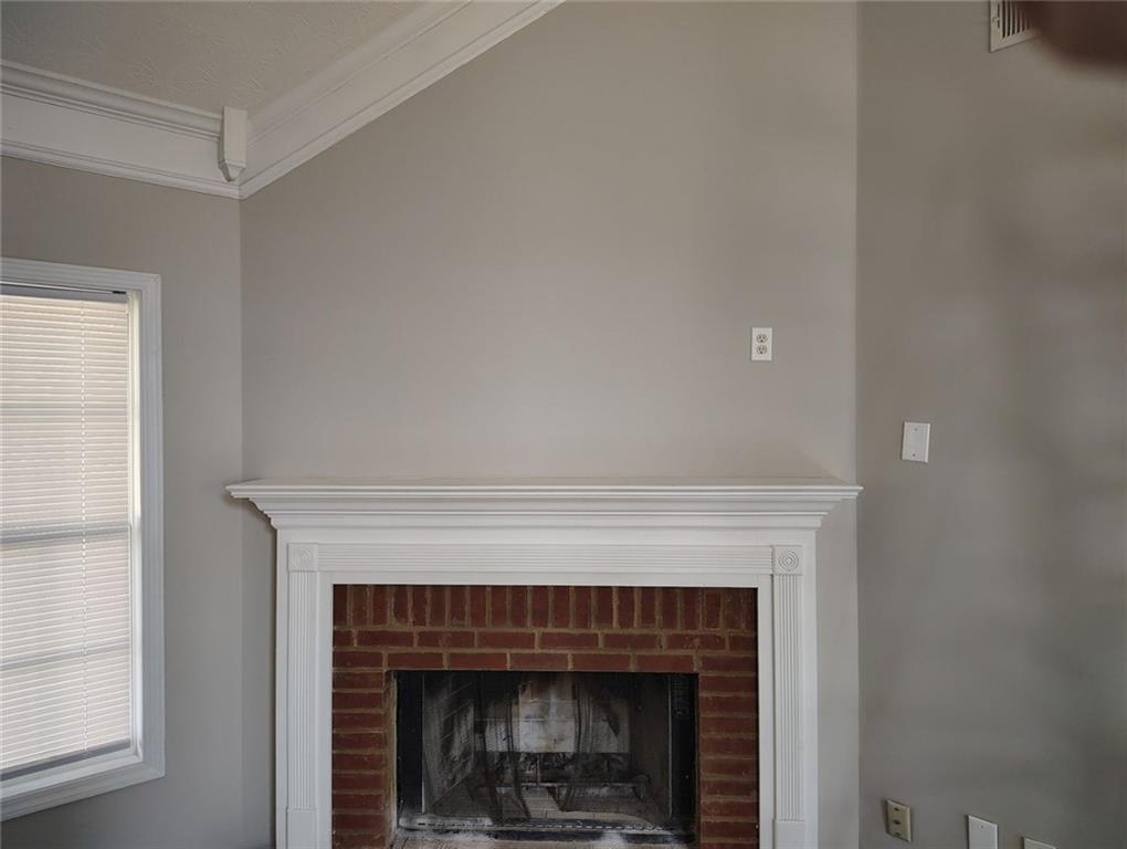 85 Hollow Court Covington, GA 30016 - Photo 3 of 9 a living room with a fireplace