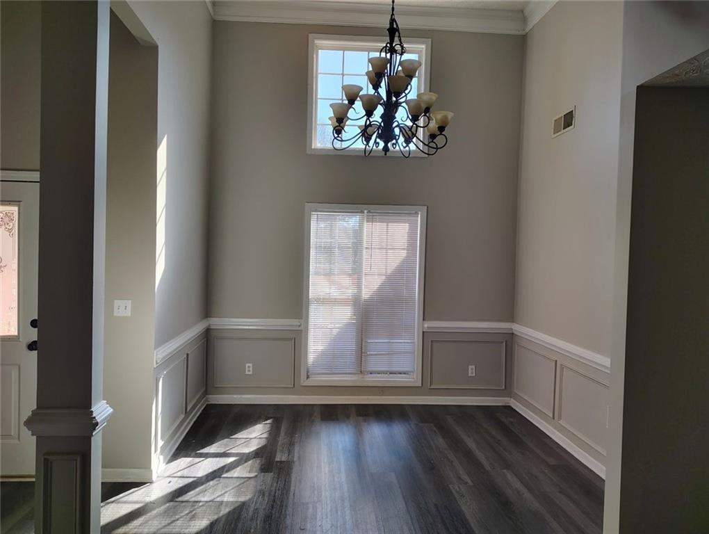 85 Hollow Court Covington, GA 30016 - Photo 4 of 9 wooden floor in an empty room with a window