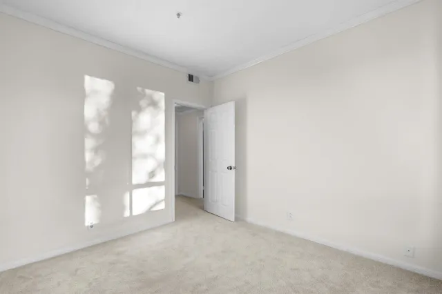 an empty room with sliding glass door