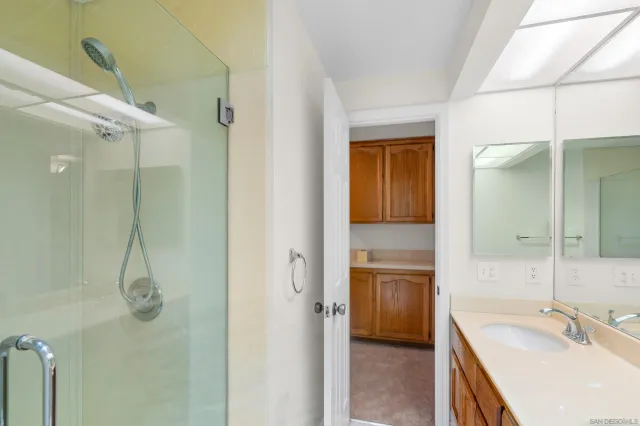 a view of an empty room with a fireplace and a window