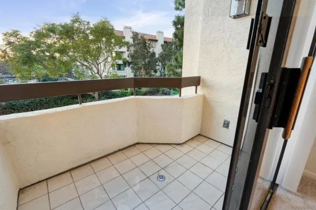 a view of an empty room with glass door