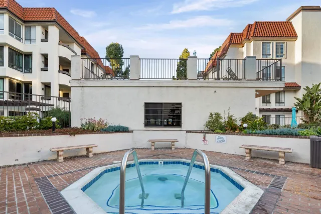 a swimming pool with outdoor seating and yard
