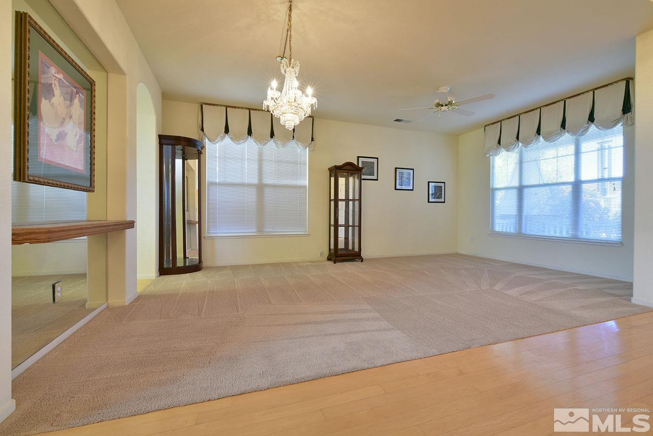 9631 Apache Rose Court Reno, NV 89521 - Photo 6 of 39 a view of a big room with windows and chandelier