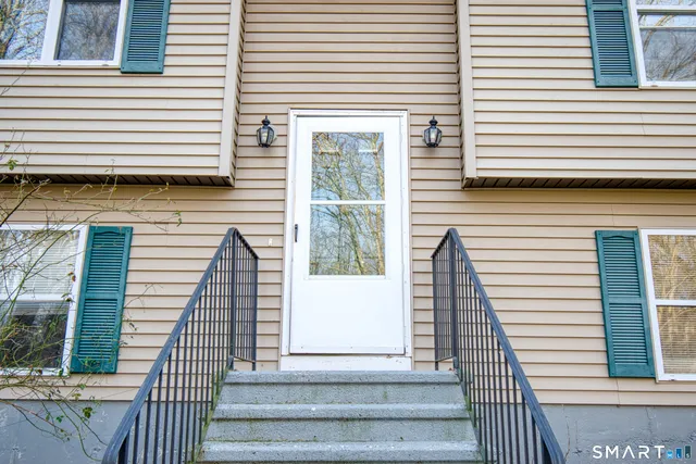a view of a balcony with wooden floor and staircase