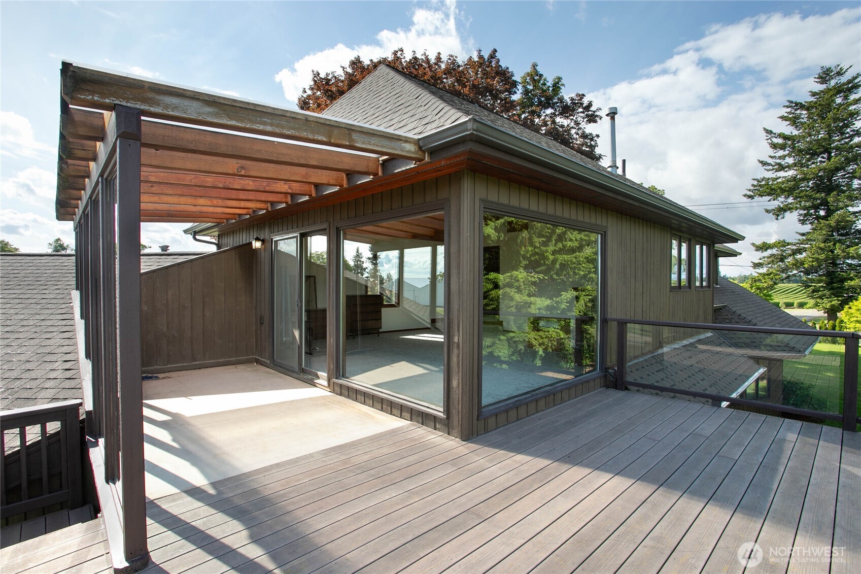 1133 East Pole Road Everson, WA 98247 - Photo 30 of 40 a patio with table and chairs and wooden floor