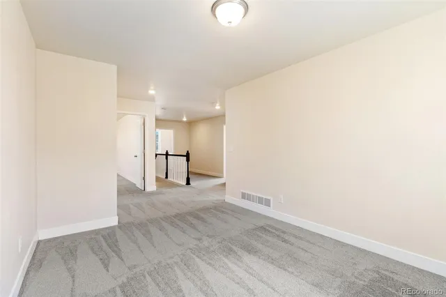 a view of a kitchen with a sink and a window