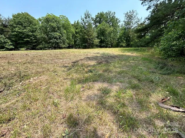 an empty room with a empty space and windows
