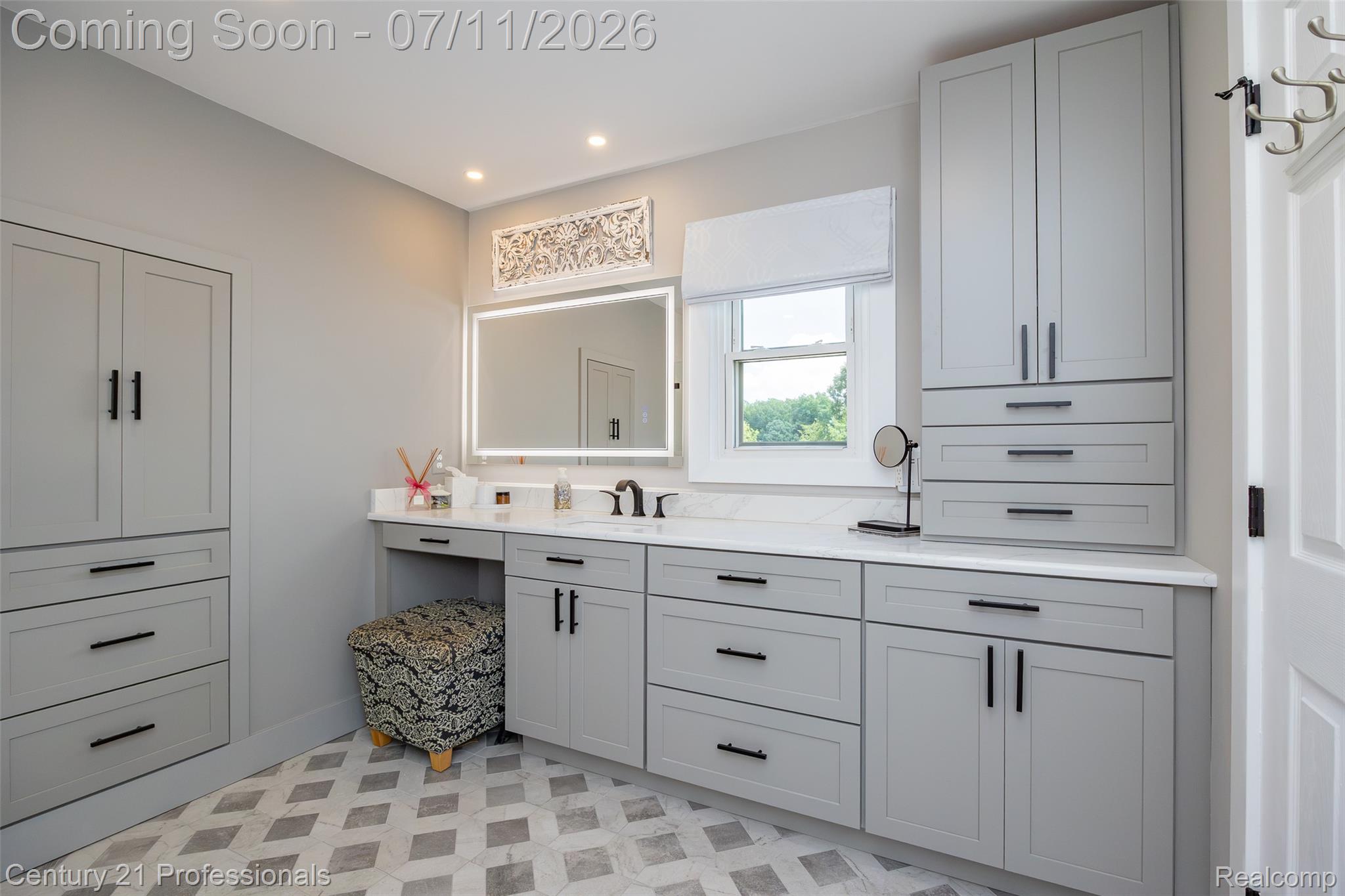 689 Woodfield Way Rochester, MI 48307 - Photo 11 of 61 Bathroom vanity with extensive gray cabinetry, contrasting dark hardware, and bright white countertops