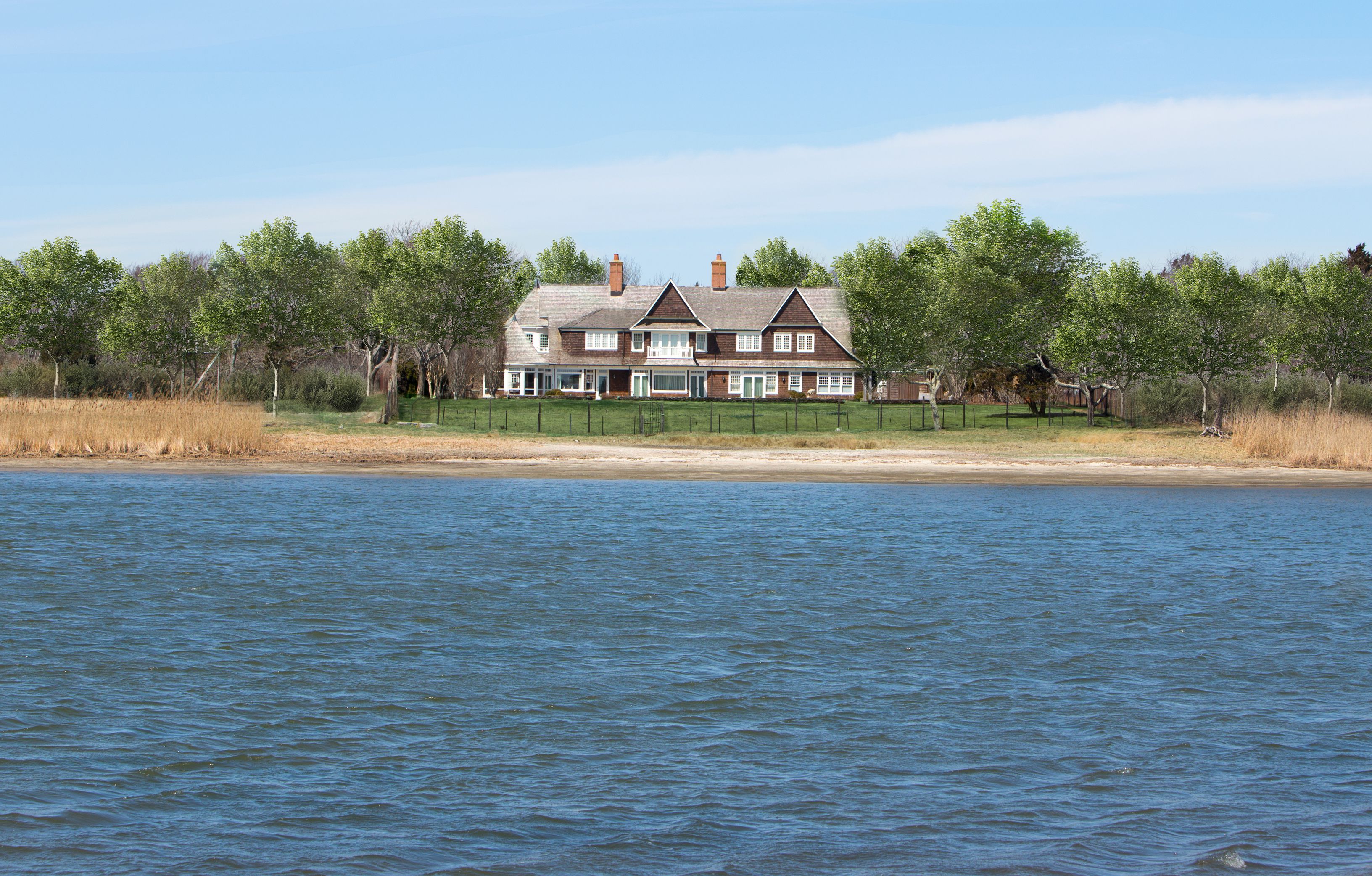 7 Chauncey Close East Hampton, NY 11937 - Photo 1 of 15 a view of a swimming pool and trees in the background