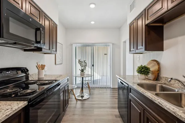 a kitchen with a stove and a sink