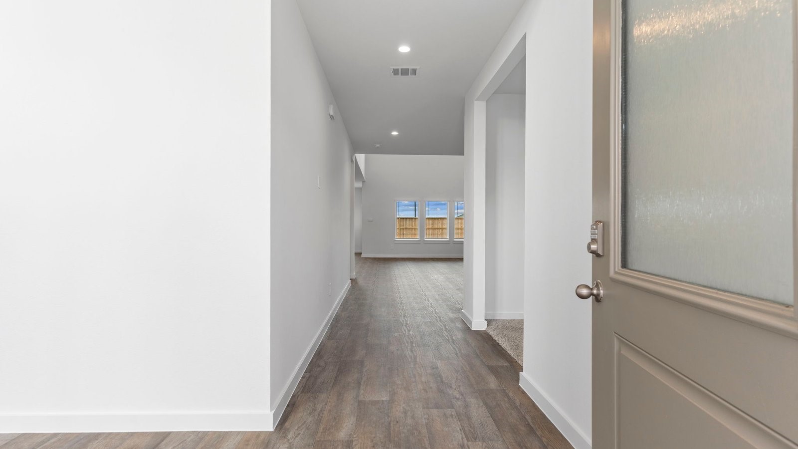 6120 Cherry Mdws Street Rosenberg, TX 77469 - Photo 5 of 39 a view of a hallway with wooden floor