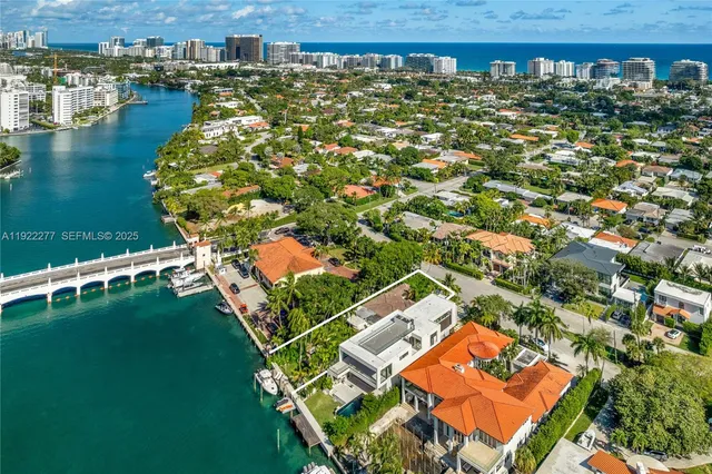an aerial view of a house with a lake view
