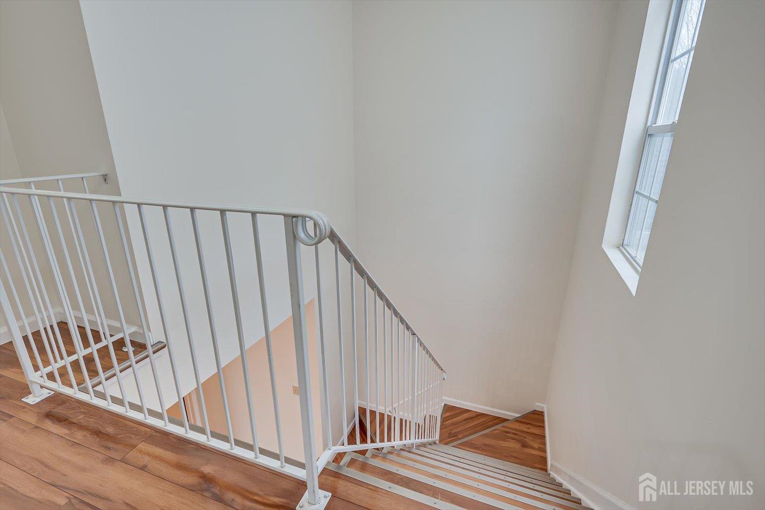 919 Plymouth Road North Brunswick, NJ 08902 - Photo 20 of 33 a view of staircase with railing and white walls