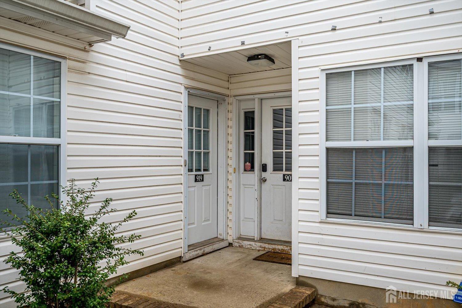 919 Plymouth Road North Brunswick, NJ 08902 - Photo 3 of 33 a view of a house with a door and a tree