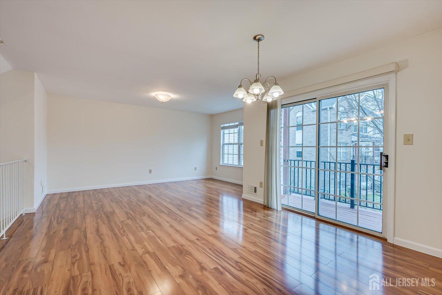 919 Plymouth Road North Brunswick, NJ 08902 - Photo 6 of 33 a view of livingroom with hardwood floor and window