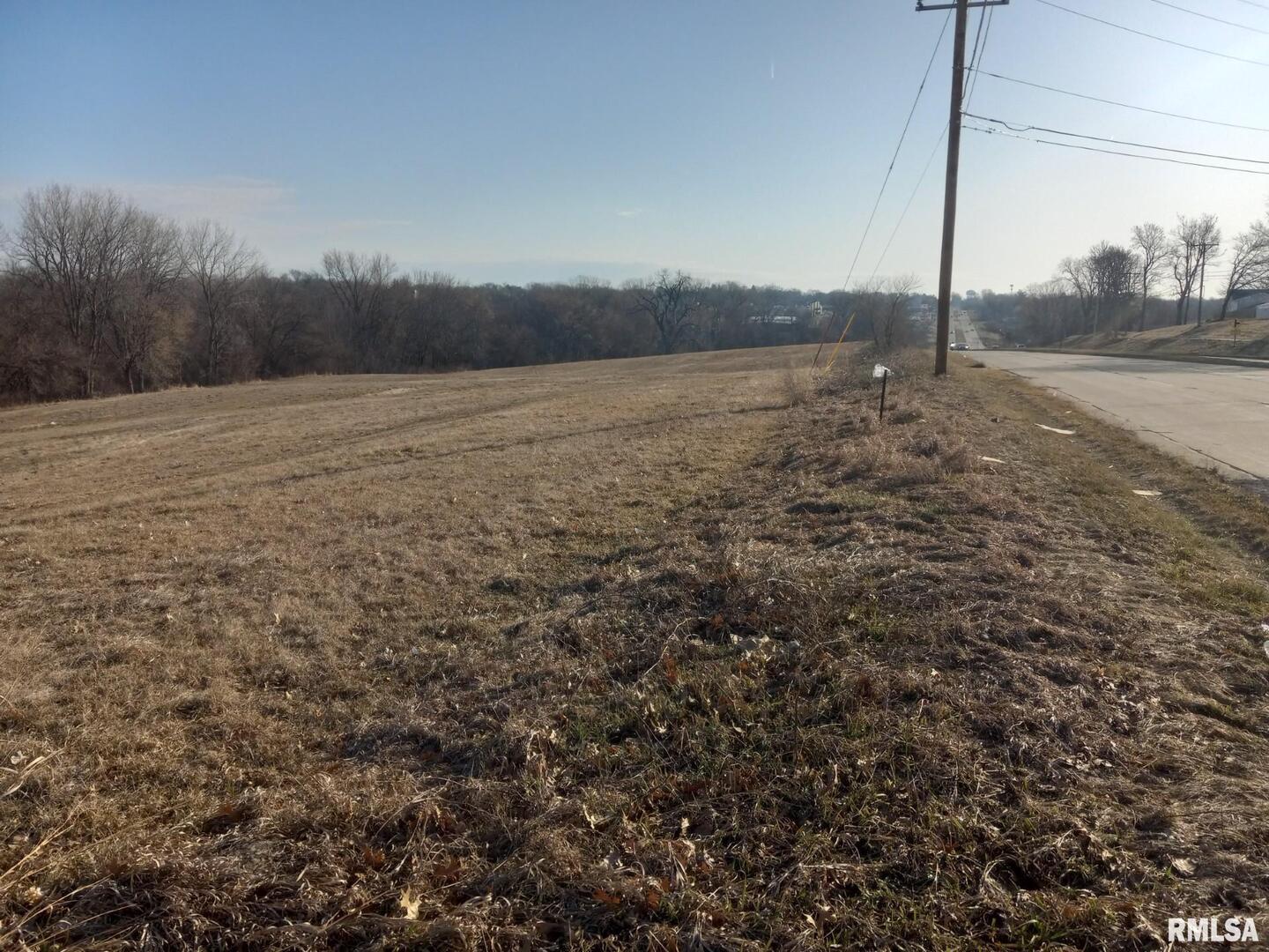 0 West Kimberly Road Davenport, IA 52806 - Photo 2 of 8 a view of a road with a dry yard
