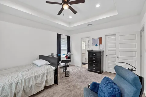a bed room with a bed and furniture