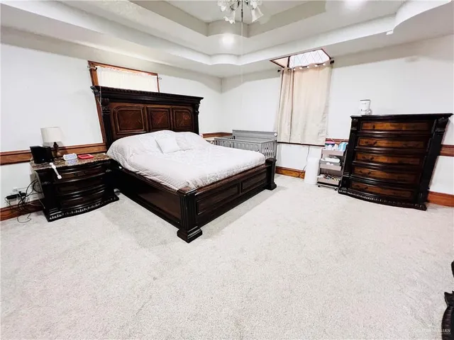 a bedroom with a bed and dresser