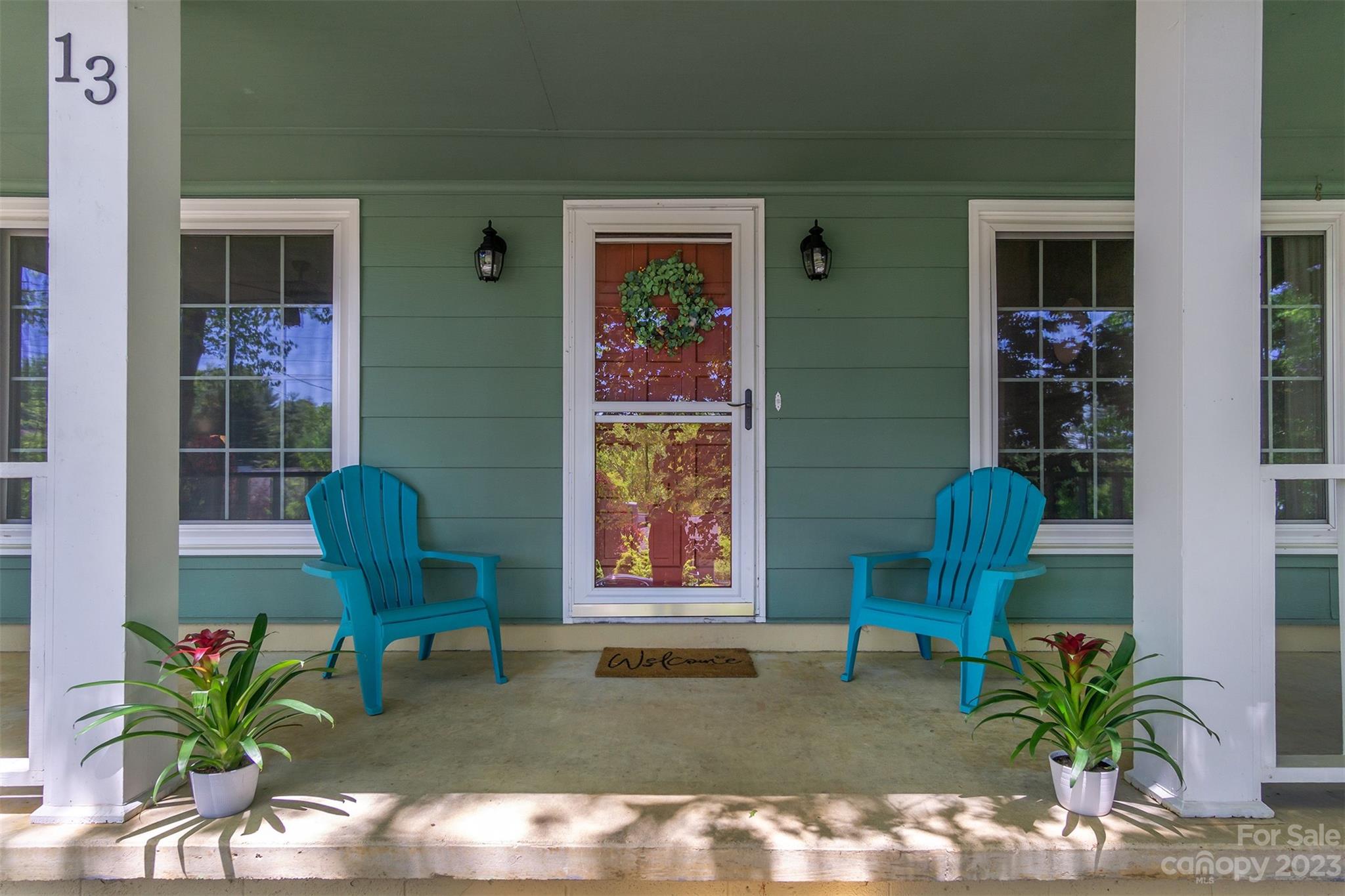13 Woodfield Road Arden, NC 28704 - Photo 1 of 41 a living room with furniture and a potted plant