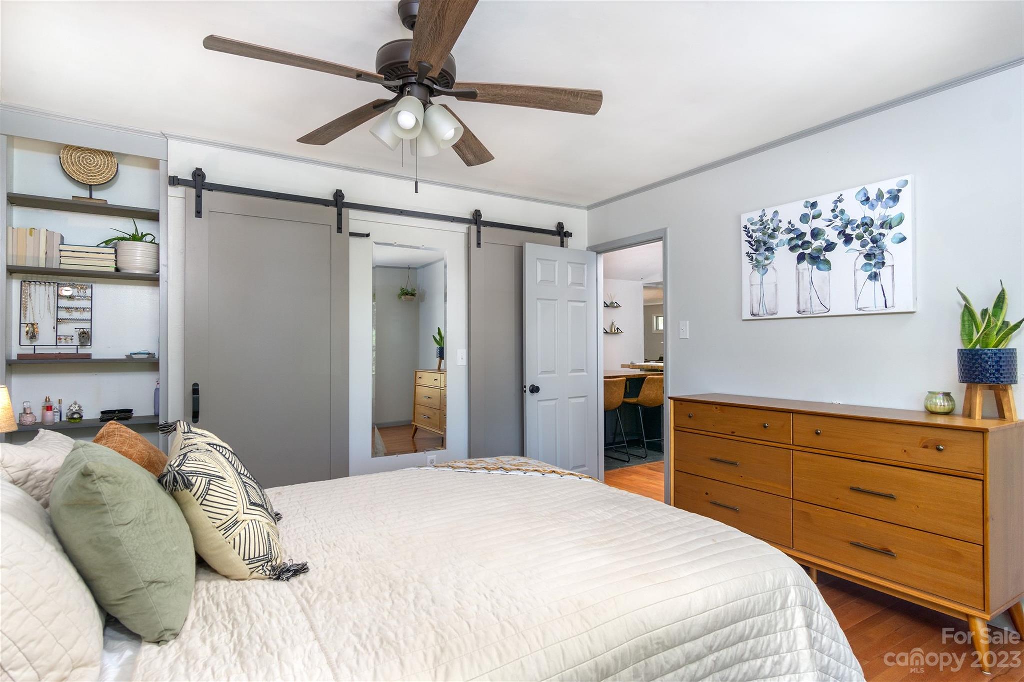 13 Woodfield Road Arden, NC 28704 - Photo 16 of 41 a bedroom with a bed and a chandelier