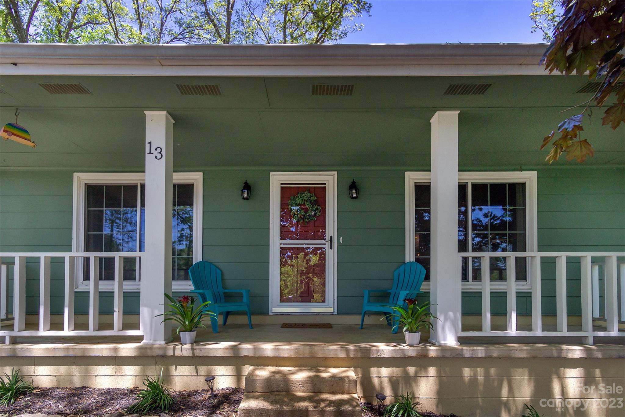 13 Woodfield Road Arden, NC 28704 - Photo 2 of 41 a front view of a house with a garden