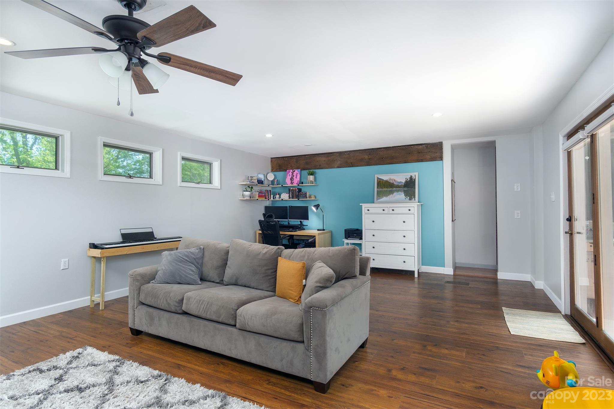 13 Woodfield Road Arden, NC 28704 - Photo 21 of 41 a living room with furniture and a wooden floor
