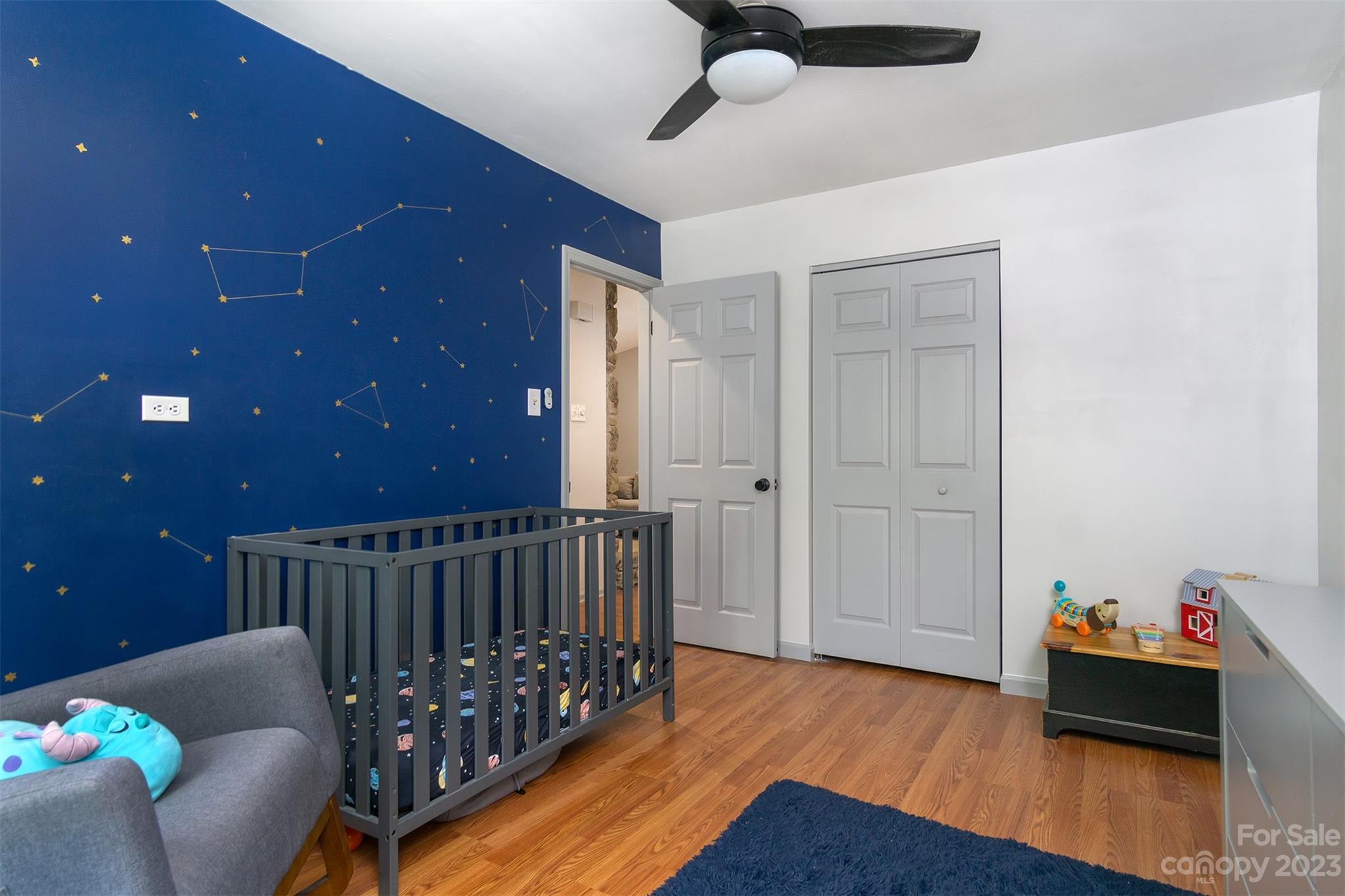 13 Woodfield Road Arden, NC 28704 - Photo 23 of 41 a bedroom with furniture and wooden floor