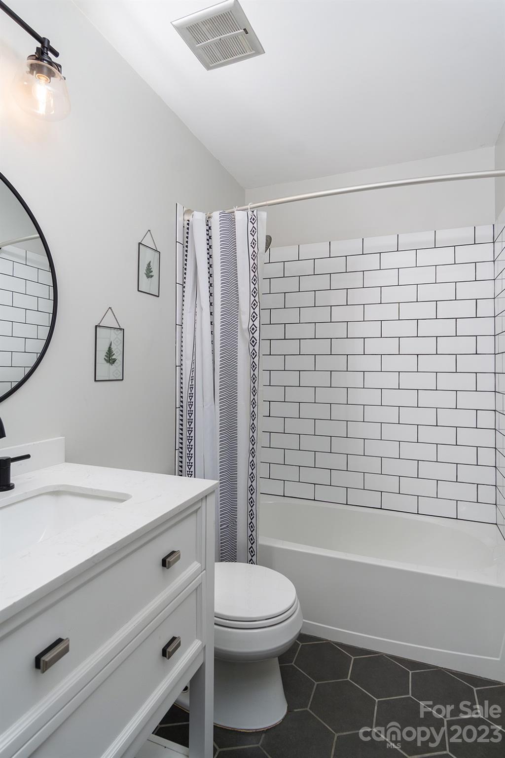 13 Woodfield Road Arden, NC 28704 - Photo 25 of 41 a bathroom with a sink a toilet and shower