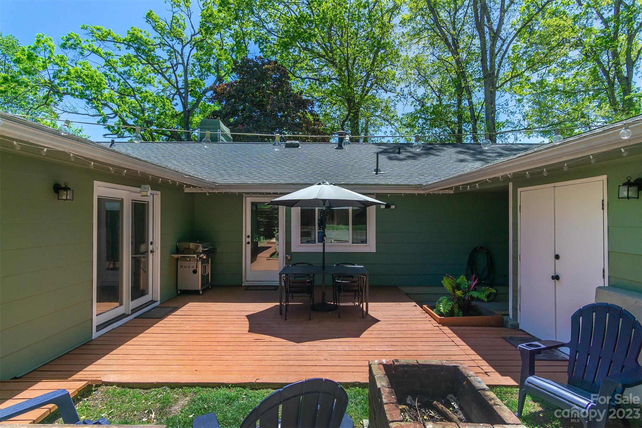 13 Woodfield Road Arden, NC 28704 - Photo 27 of 41 a view of a house with backyard and sitting area