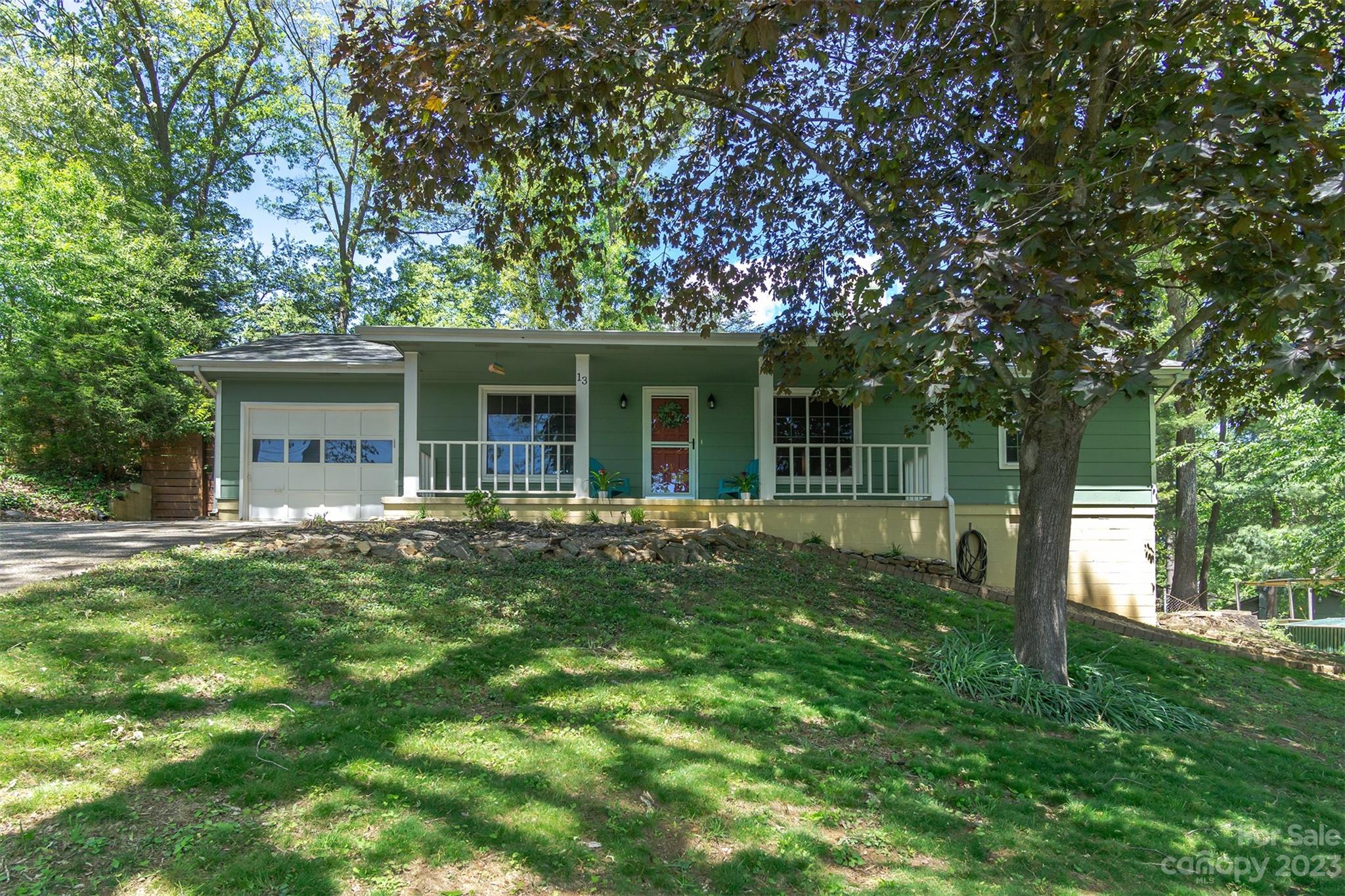 13 Woodfield Road Arden, NC 28704 - Photo 3 of 41 front view of house with a yard