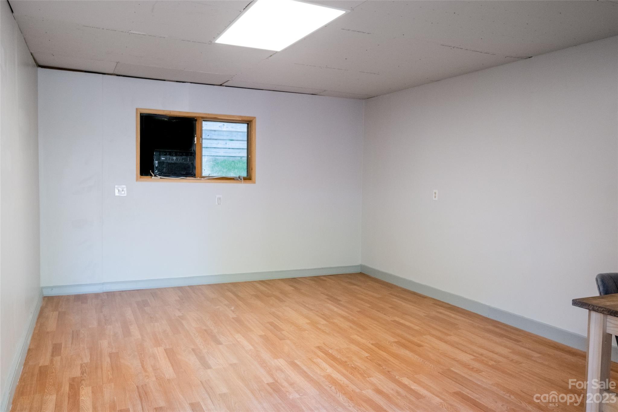 13 Woodfield Road Arden, NC 28704 - Photo 33 of 41 a view of an empty room with wooden floor and a window
